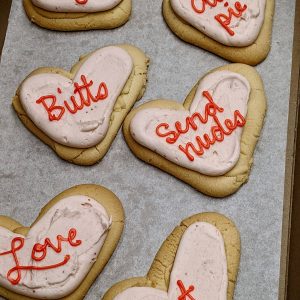 heart shaped shortbread cookies with saynigs "love" "cutie pie" "butts" "send nudes" "love" "hot"