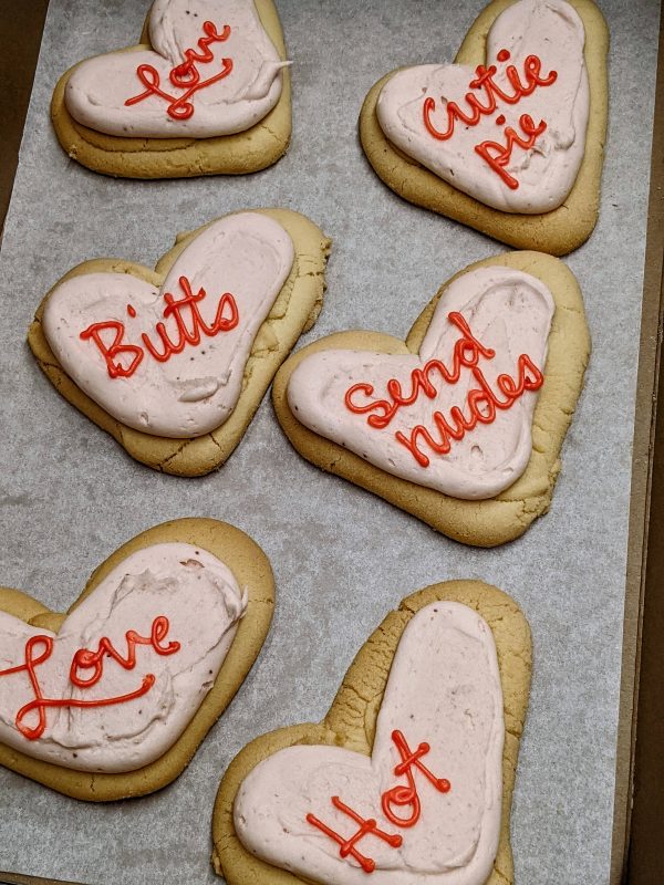 heart shaped shortbread cookies with saynigs "love" "cutie pie" "butts" "send nudes" "love" "hot"